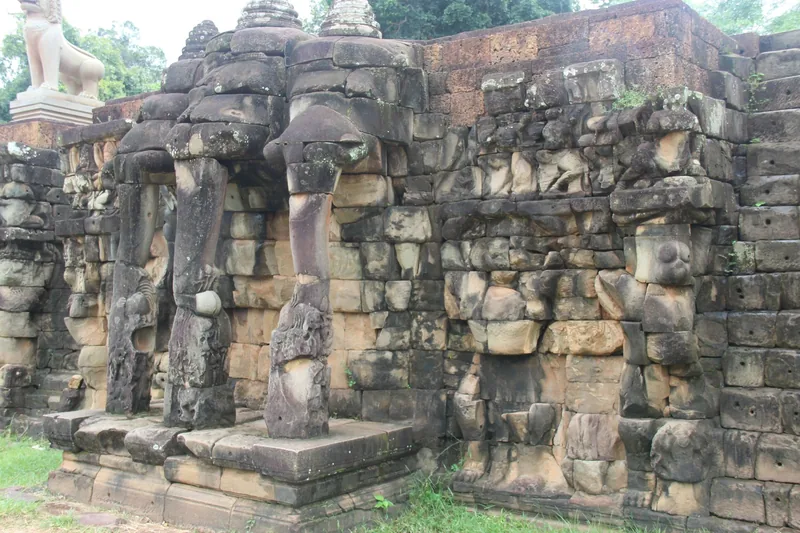 Weathered stone elephant carvings decorate the ancient wall at the Terrace of the Elephants in Angkor Thom, Siem Reap.